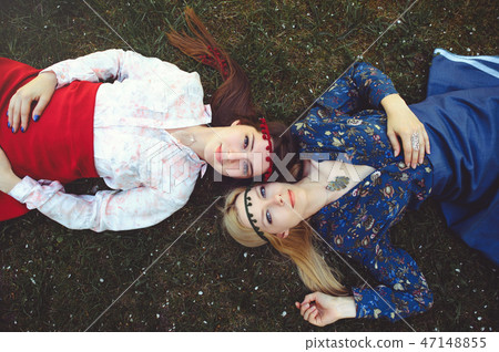 Portrait of young beautiful women lying on  47148855
