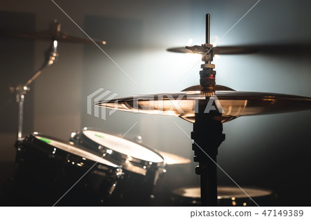 Close-up Drum set in a dark room against the backdrop of the spotlight. Atmospheric background Close-up Drum set in a dark room against the backdrop of the spotlight. Atmospheric background 47149389