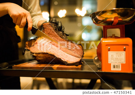 Chef cutting briquette meat Chef cutting briquette meat 47150341