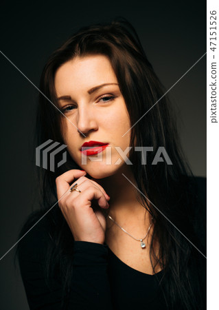 emotional girl smiling on a dark background 47151526