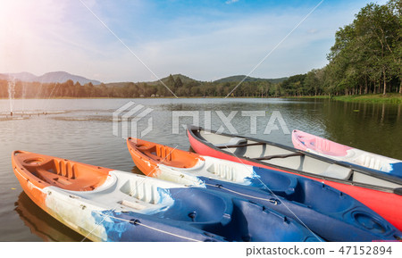 Kayak boats at the lake. Kayak boats at the lake. 47152894