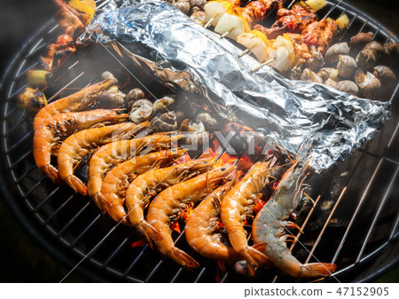 Grilled flame fire seafood. 47152905