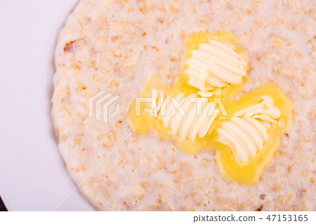 Porridge on milk with butter 47153165