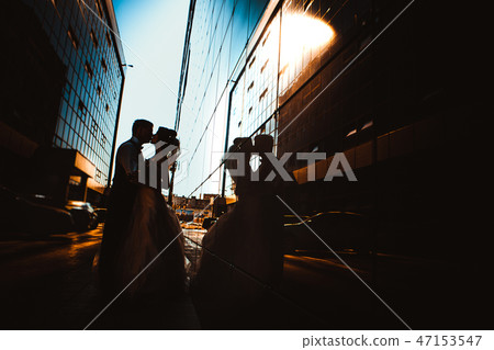 Wedding couple on backround mirror buildings Wedding couple on backround mirror buildings 47153547