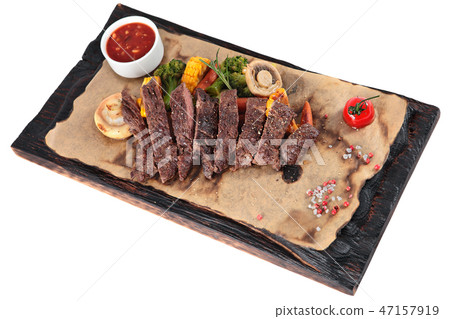 Slice into pieces fried Skirt steak and vegetables 47157919