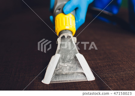 Sofa chemical cleaning with professionally extraction method. Upholstered furniture. Early spring Sofa chemical cleaning with professionally extraction method. Upholstered furniture. Early spring 47158023