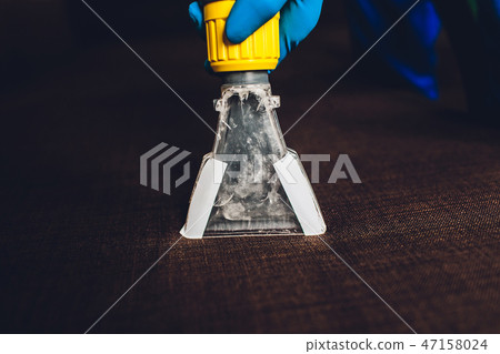 Sofa chemical cleaning with professionally extraction method. Upholstered furniture. Early spring Sofa chemical cleaning with professionally extraction method. Upholstered furniture. Early spring 47158024