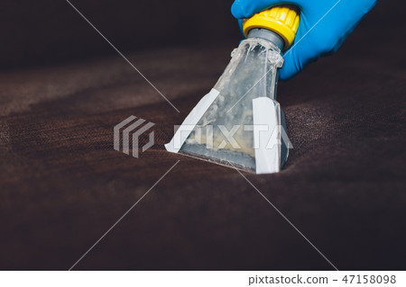 Sofa chemical cleaning with professionally extraction method. Upholstered furniture. Early spring Sofa chemical cleaning with professionally extraction method. Upholstered furniture. Early spring 47158098