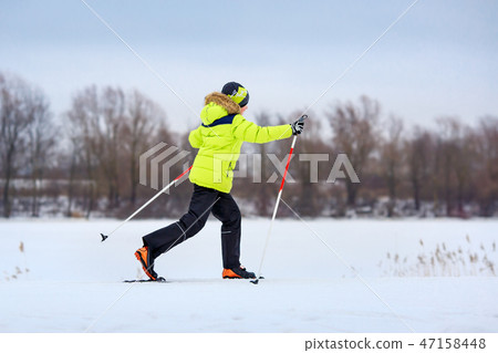 Cute little boy having fun during skiing on cross Cute little boy having fun during skiing on cross 47158448