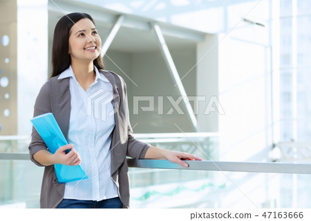 Attractive woman in office building Attractive woman in office building 47163666