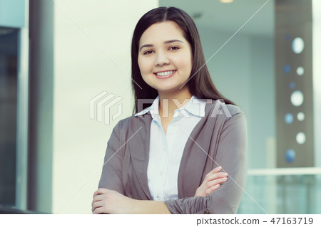 Attractive woman in office building 47163719