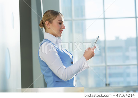 Attractive woman in office building Attractive woman in office building 47164214