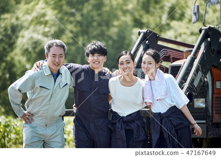 Man and woman farming tractor 47167649