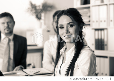 Beautiful smiling brunette clerk girl at workplace 47169291