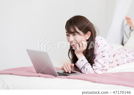 A woman on the bed 47170146