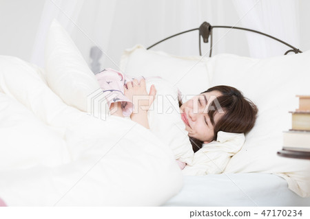 A woman on the bed 47170234