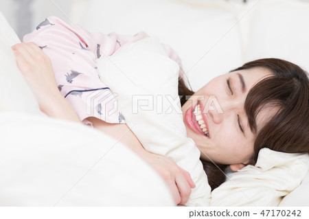 A woman on the bed 47170242