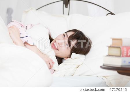 A woman on the bed 47170243