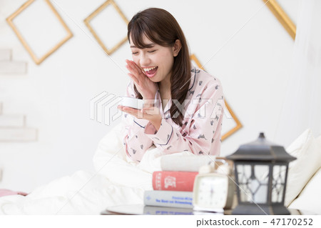 A woman on the bed 47170252