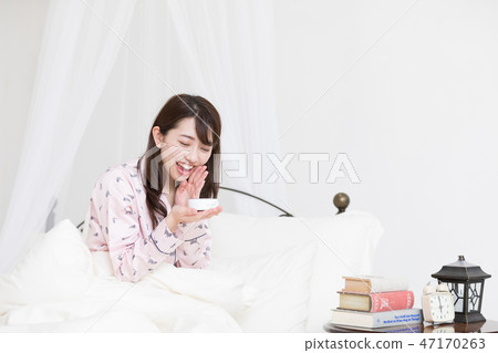 A woman on the bed 47170263