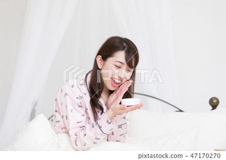 A woman on the bed 47170270