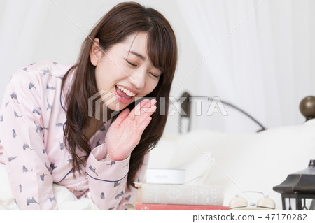 A woman on the bed 47170282