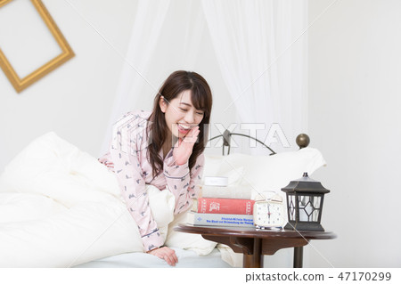 A woman on the bed 47170299