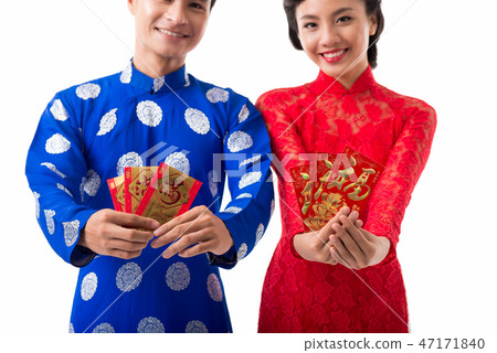 Cheerful Asian couple celebrating Lunar Year Cheerful Asian couple celebrating Lunar Year 47171840