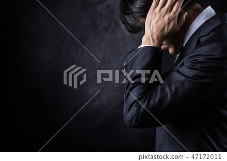 A businessman who closes his ears A businessman who closes his ears 47172011