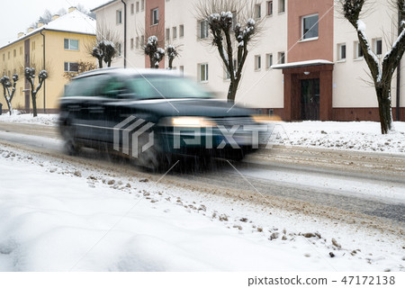 Snow calamity on the road. Car driving at winter 47172138