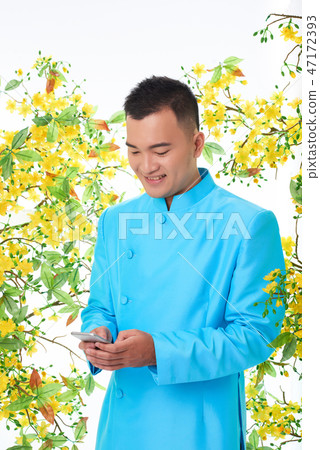 Texting man at Tet celebration 47172393