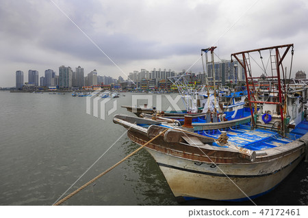 Fishing boats and new towns 47172461