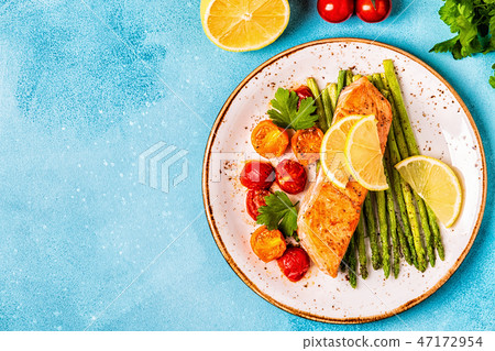 Grilled salmon with asparagus and tomatoes. Grilled salmon with asparagus and tomatoes. 47172954