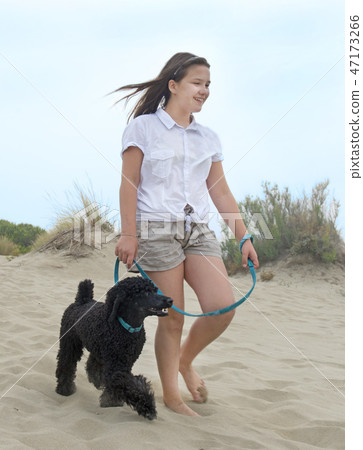 children and poodle 47173266