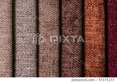 Colorful and bright fabric samples of furniture and clothing upholstery. Close-up of a palette of Colorful and bright fabric samples of furniture and clothing upholstery. Close-up of a palette of 47175173