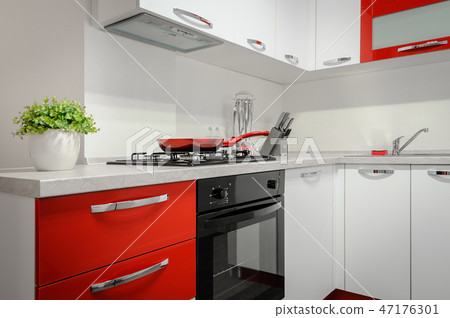 Modern red and white kitchen interior Modern red and white kitchen interior 47176301