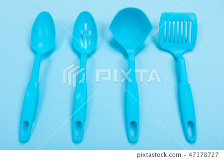 Composition of kitchen utensils for cooking isolated on colorful blue background Composition of kitchen utensils for cooking isolated on colorful blue background 47178727