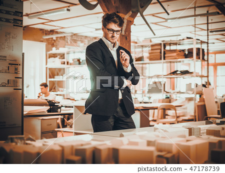 Confident engineer working in an architect studio 47178739