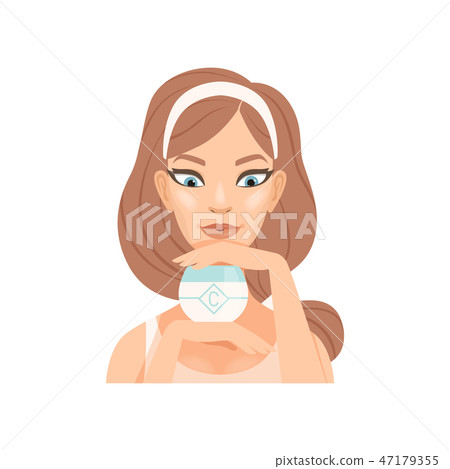 Attractive young woman with cream jar, girl caring for her face and skin, facial treatment procedure 47179355