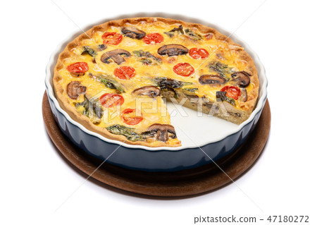 Baked homemade quiche pie in ceramic baking form Baked homemade quiche pie in ceramic baking form 47180272