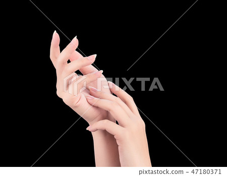 Female hand smear milk frost remedy dark skin black background 47180371