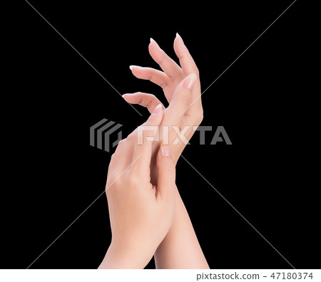Female hand smear milk frost remedy dark skin black background 47180374