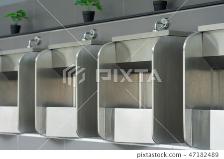 Public male bathroom is made of stainless steel Public male bathroom is made of stainless steel 47182489