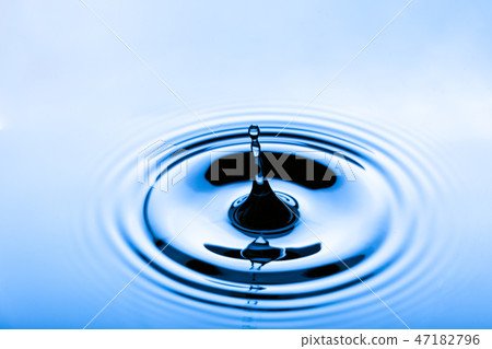 Blue water droplets on a shiny surface Blue water droplets on a shiny surface 47182796