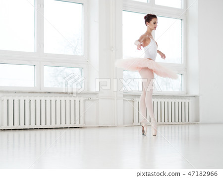 Gracefull ballerina in a dance studio 47182966