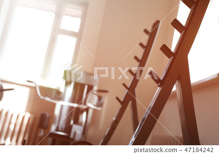 Closeup of empty rack for barbells 47184242