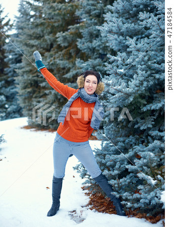 Woman is posing in winter forest Woman is posing in winter forest 47184584