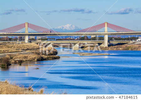Nagoya High Speed Red Tonbo Bridge and Mt. Ontake over the Shonai River, Aichi Prefecture Nagoya High Speed Red Tonbo Bridge and Mt. Ontake over the Shonai River, Aichi Prefecture 47184615