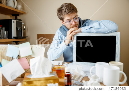 Sick man while working in office, businessman caught cold, seasonal flu. 47184983