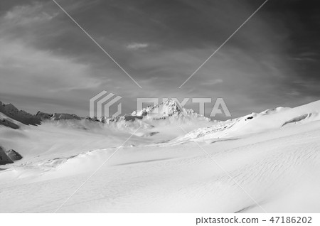 Black and white snowy mountains at winter Black and white snowy mountains at winter 47186202